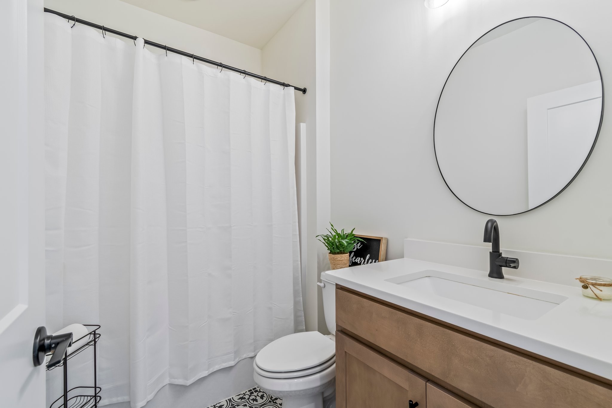 4028 John Marsh Road Spring Hill, TN 37174 - Photo 6 of 62 a bathroom with a sink a toilet and a mirror