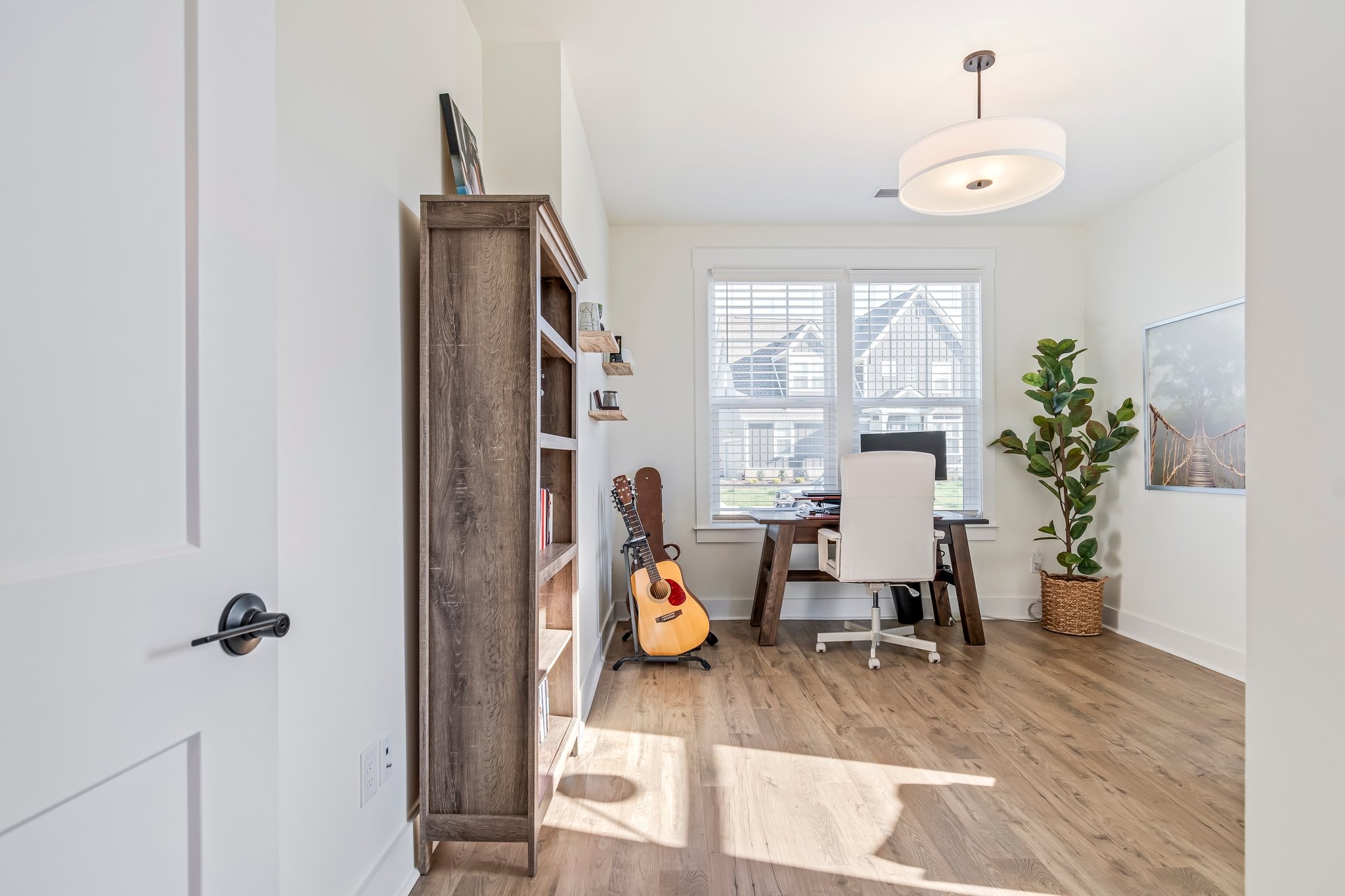 4028 John Marsh Road Spring Hill, TN 37174 - Photo 7 of 62 a view of a workspace with furniture and a potted plant
