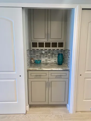 a kitchen with stainless steel appliances granite countertop a stove and a microwave