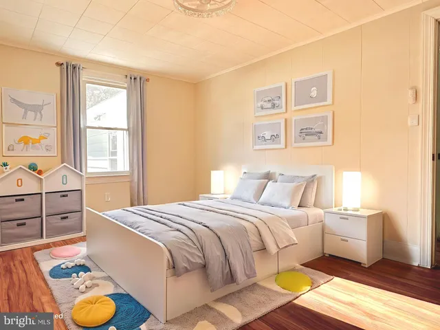 a view of a dining room with furniture and a window