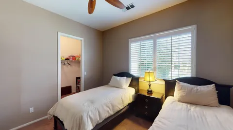 a bedroom with a bed and window