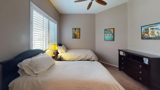 a bedroom with a bed and a dresser
