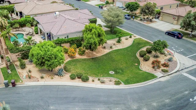 an aerial view of a house with a garden and plants