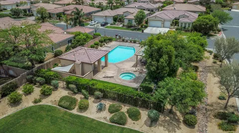 an aerial view of a house with a yard