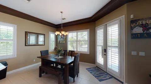 a view of a dining room with furniture window and outside view