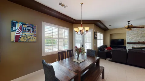 a view of a livingroom with furniture window and wooden floor