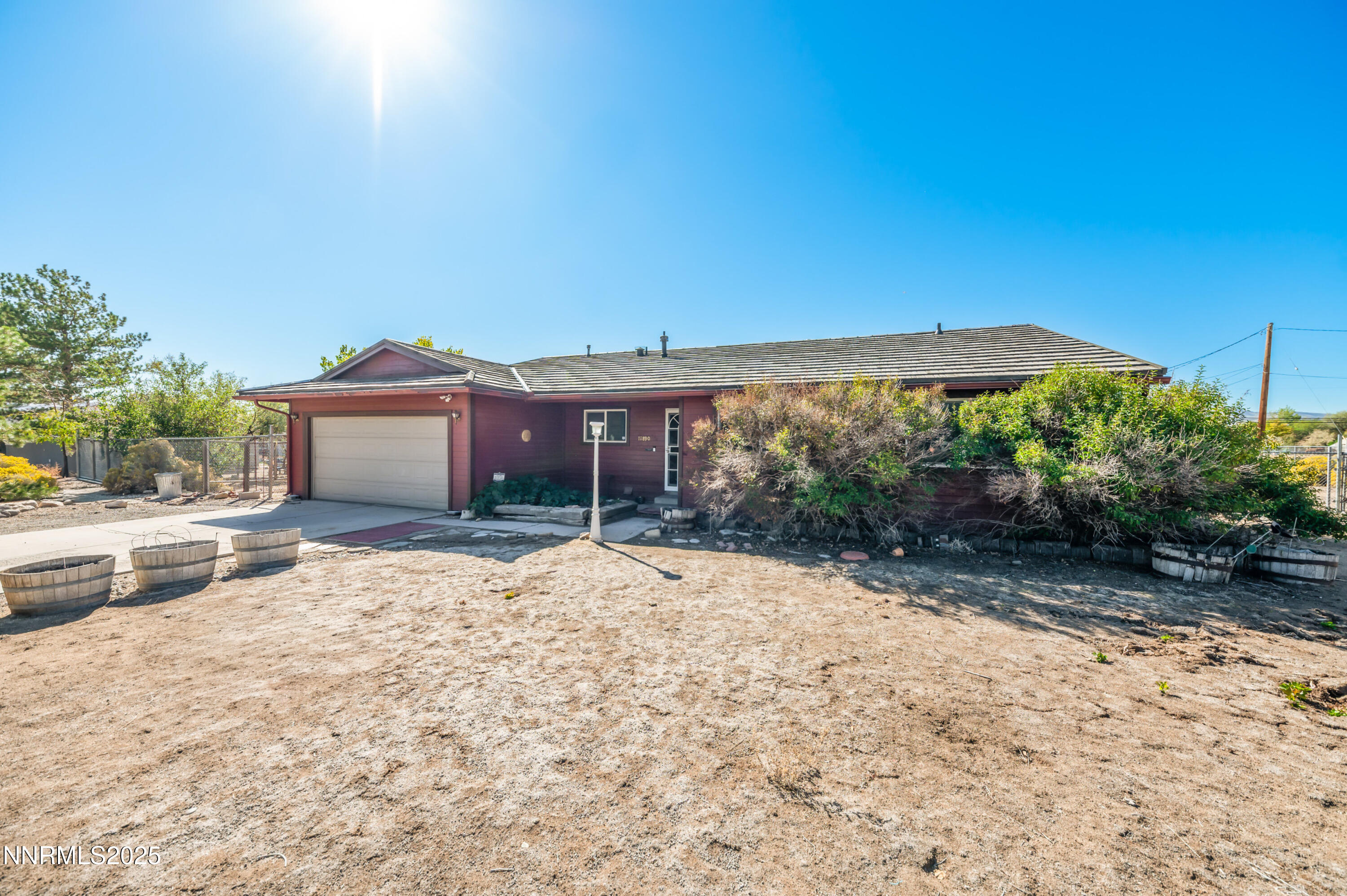 11890 Chesapeake Drive Reno, NV 89506 - Photo 29 of 33 a backyard of a house with table and chairs under an umbrella