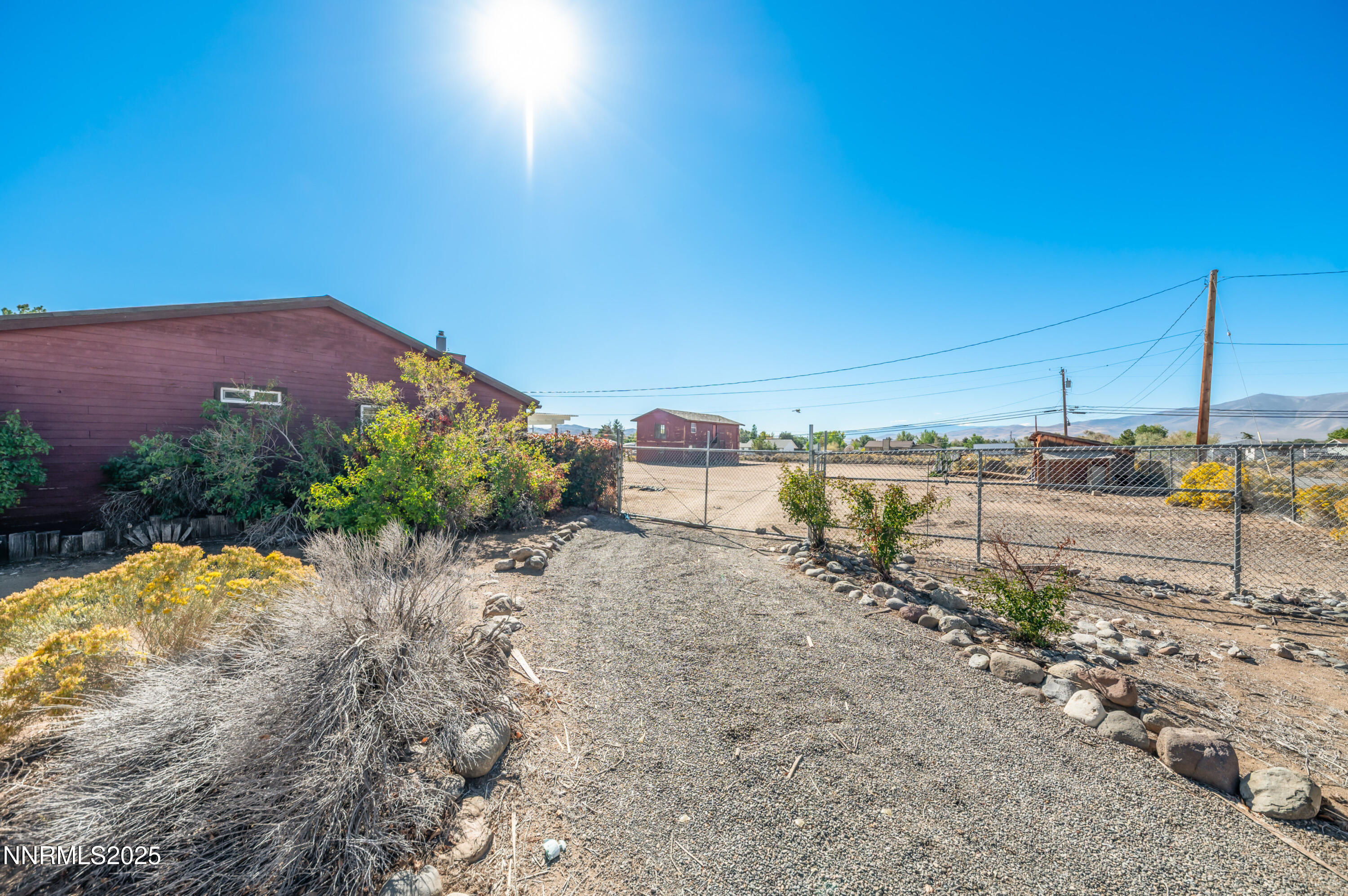 11890 Chesapeake Drive Reno, NV 89506 - Photo 32 of 33 a view of a dry yard with wooden fence
