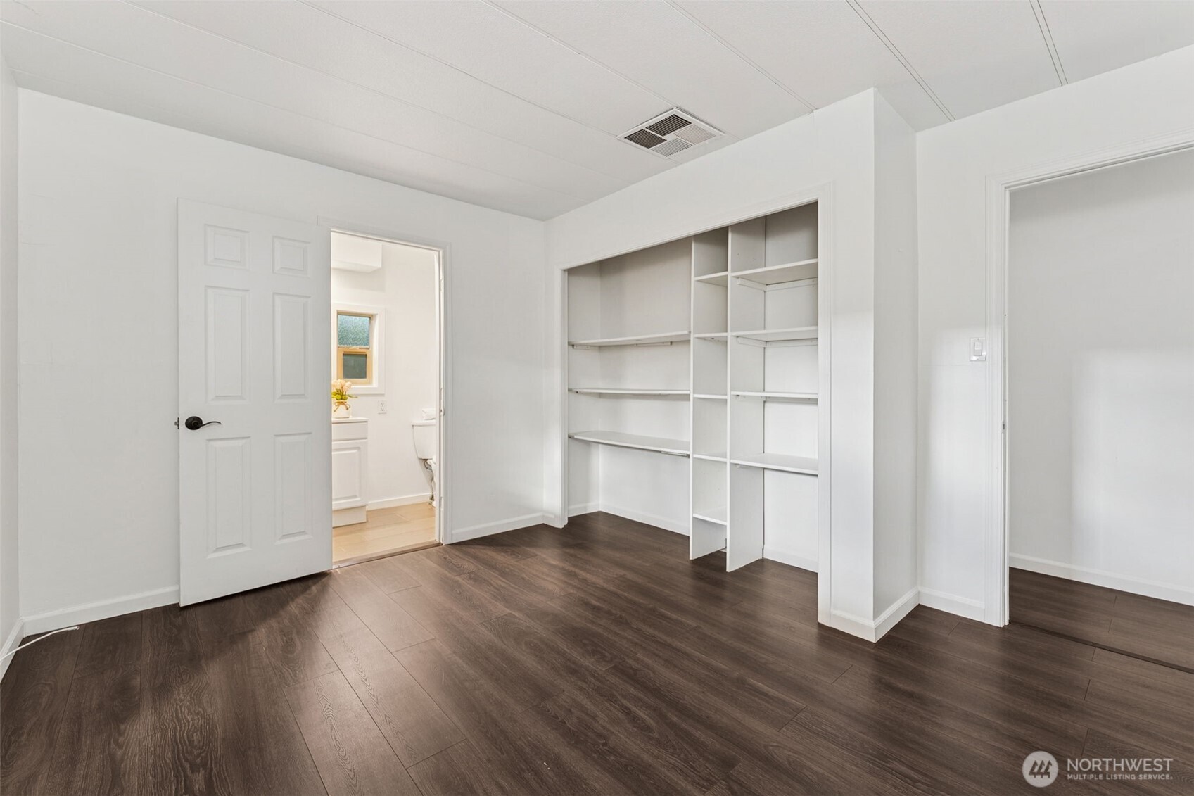 7311 Chambers Creek Road West, Unit 38 University Place, WA 98467 - Photo 11 of 15 a view of a room with wooden floor and closet