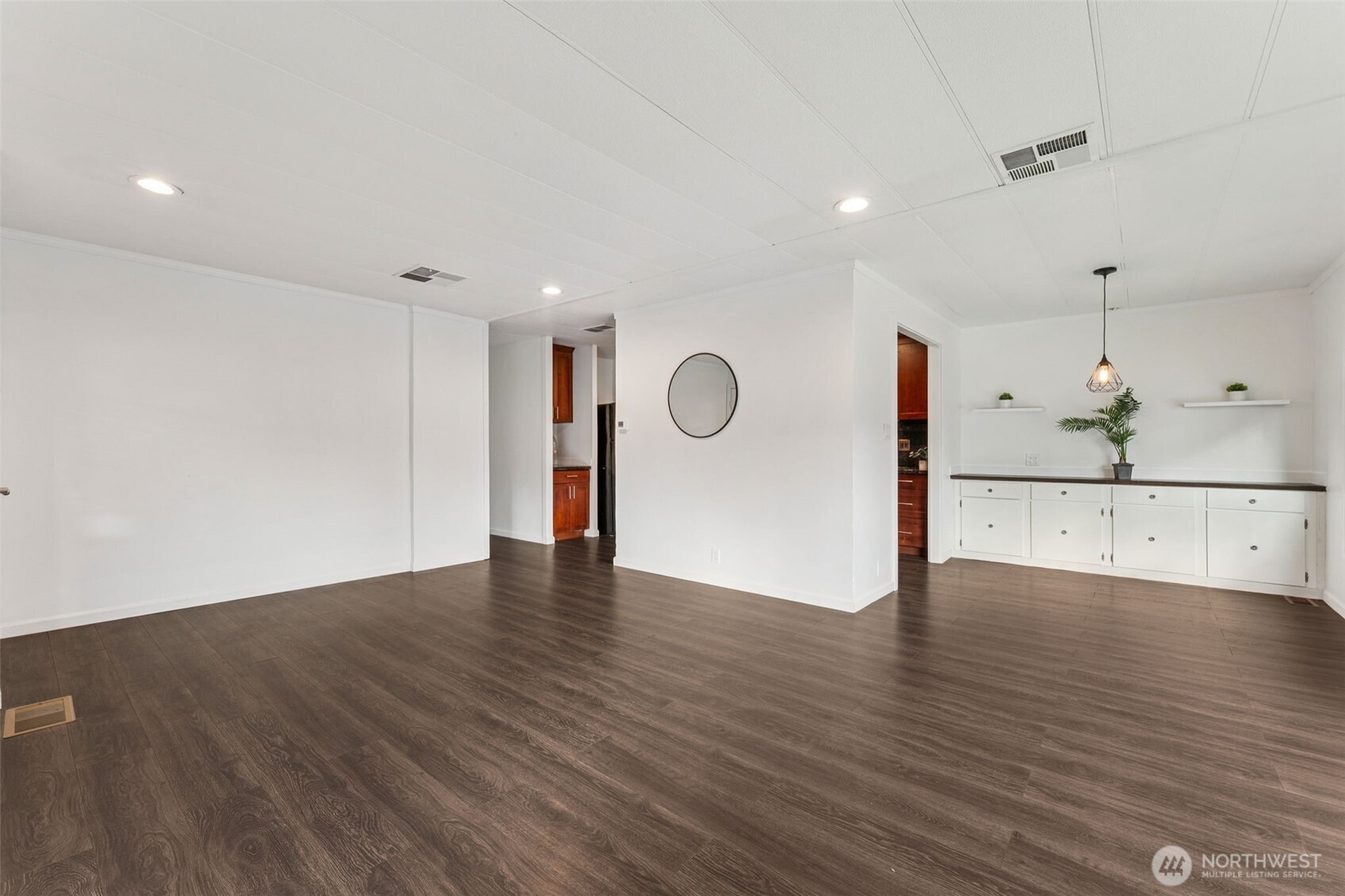 7311 Chambers Creek Road West, Unit 38 University Place, WA 98467 - Photo 3 of 15 a view of an empty room with wooden floor
