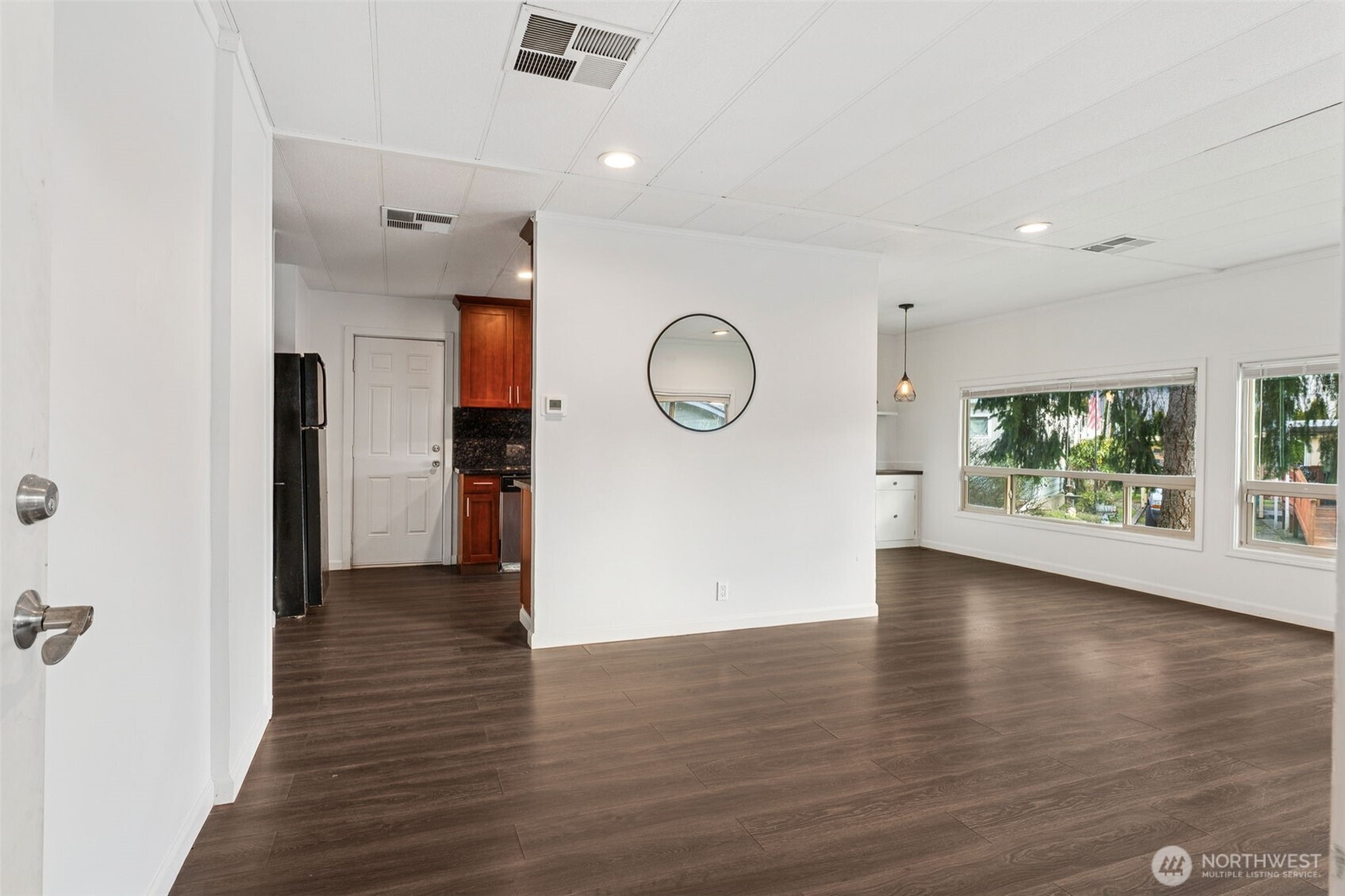 7311 Chambers Creek Road West, Unit 38 University Place, WA 98467 - Photo 4 of 15 a view of a room with wooden floor and window