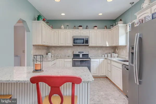 a view of living room with furniture and a window