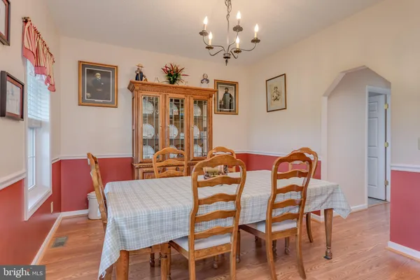 a view of a livingroom with furniture and a dinning table chair