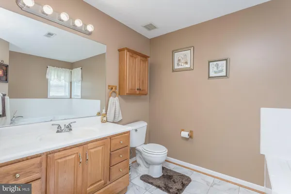 a bathroom with bathtub and shower
