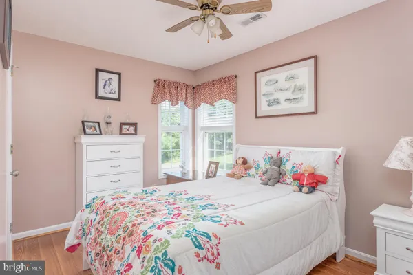 a view of house with yard and deck