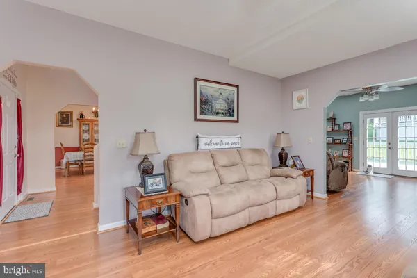 a living room with furniture fireplace and flat screen tv