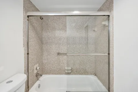 a bathroom with a shower and a bathtub