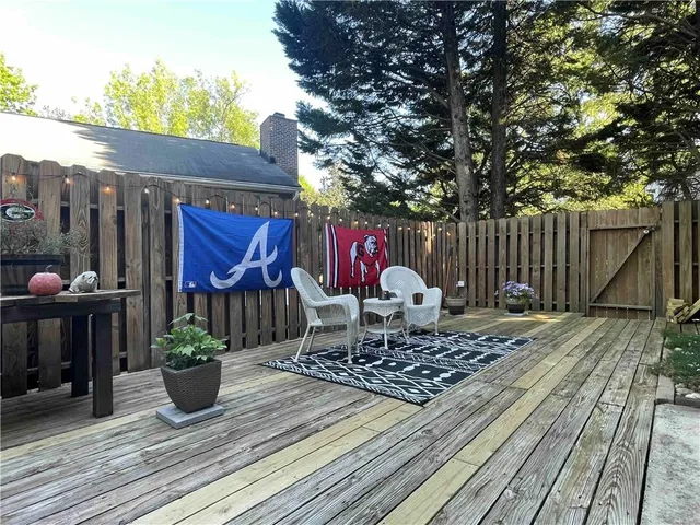 a view of a backyard with sitting area