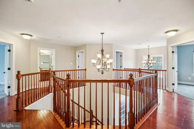 a living room with furniture and a ceiling fan
