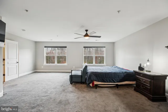 a large bathroom with a large tub and sink