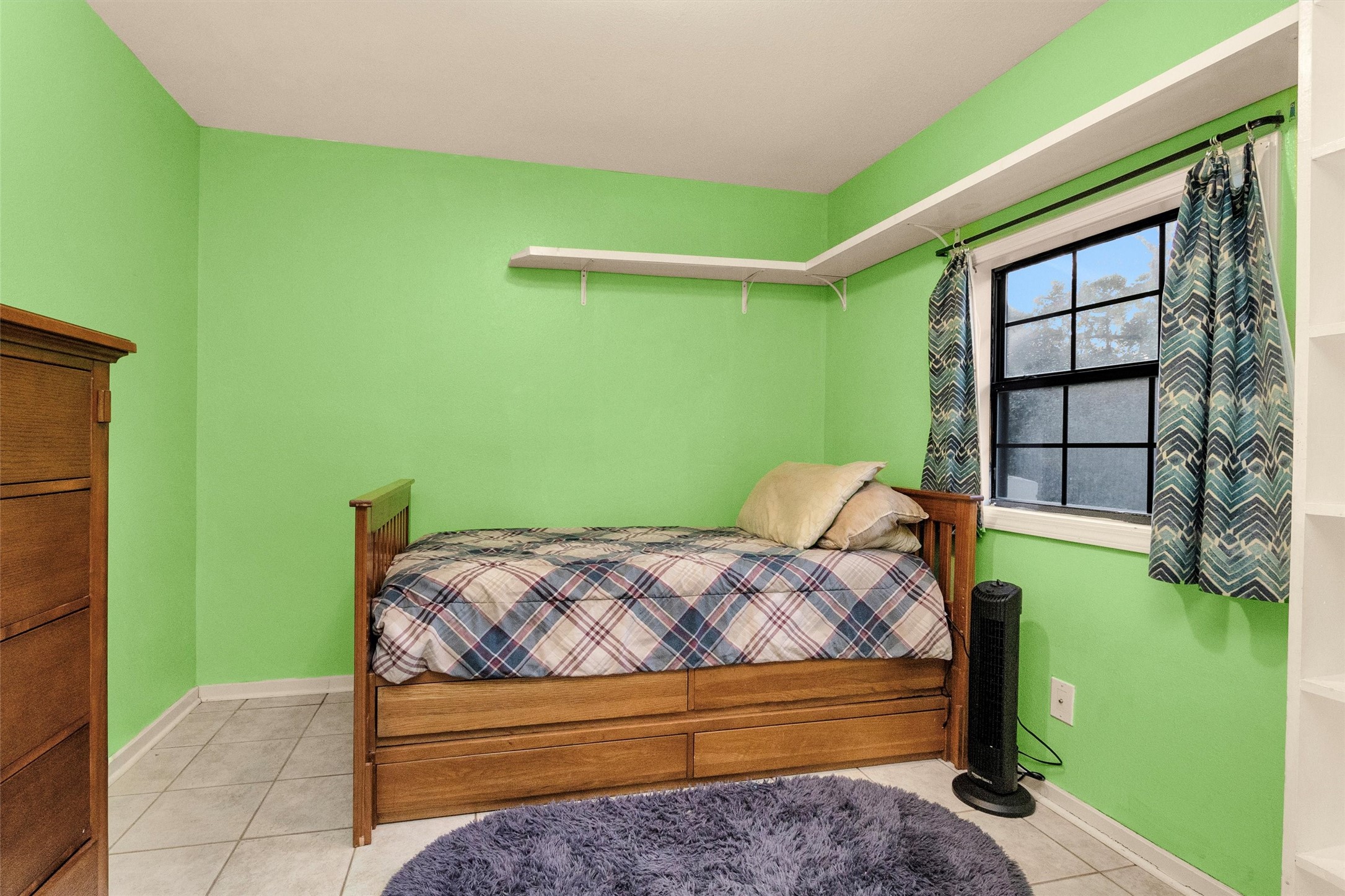 528 Catfish Lane Conroe, TX 77384 - Photo 11 of 49 a bedroom with a bed and a large window