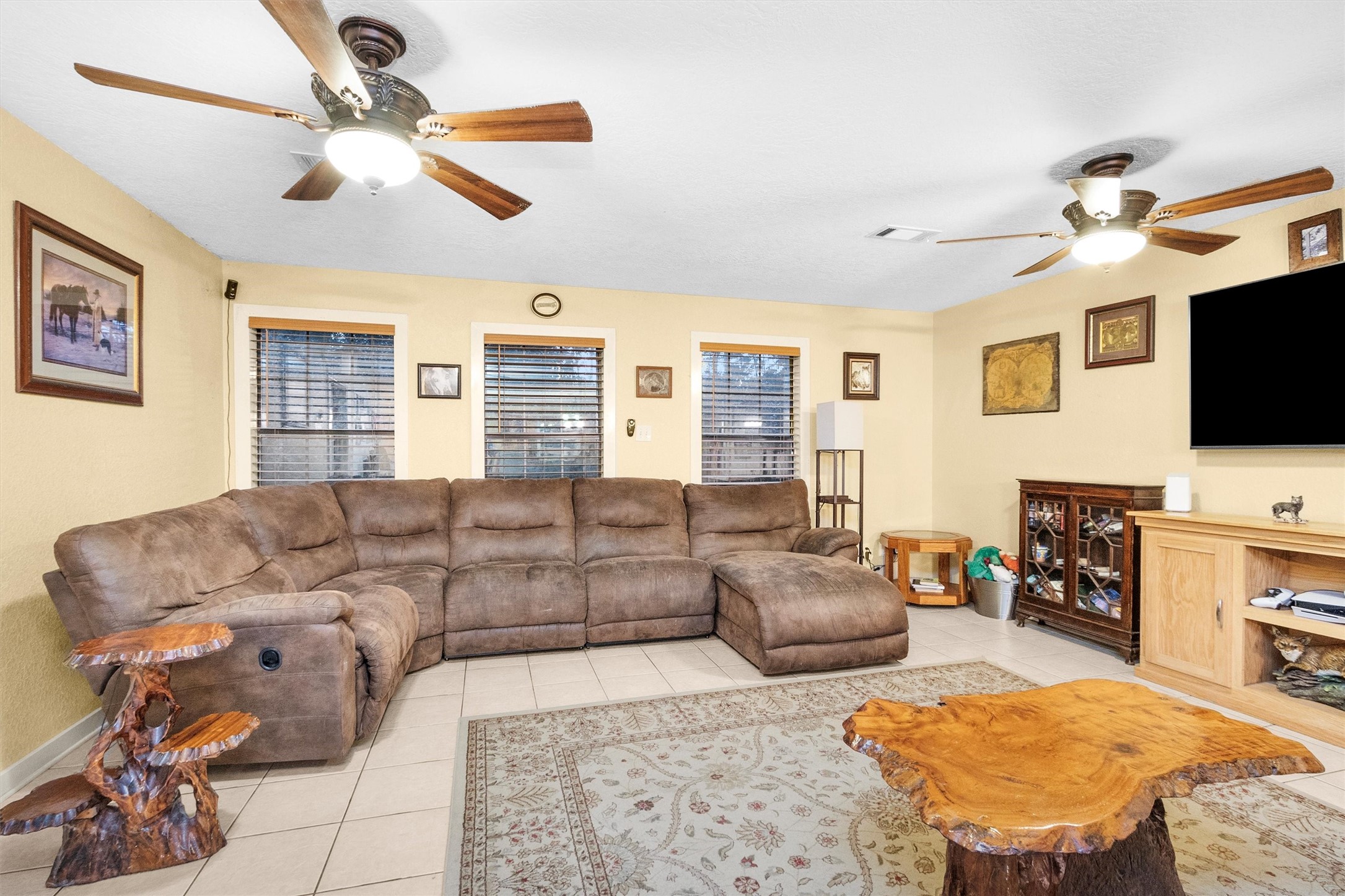 528 Catfish Lane Conroe, TX 77384 - Photo 14 of 49 a living room with furniture and a flat screen tv