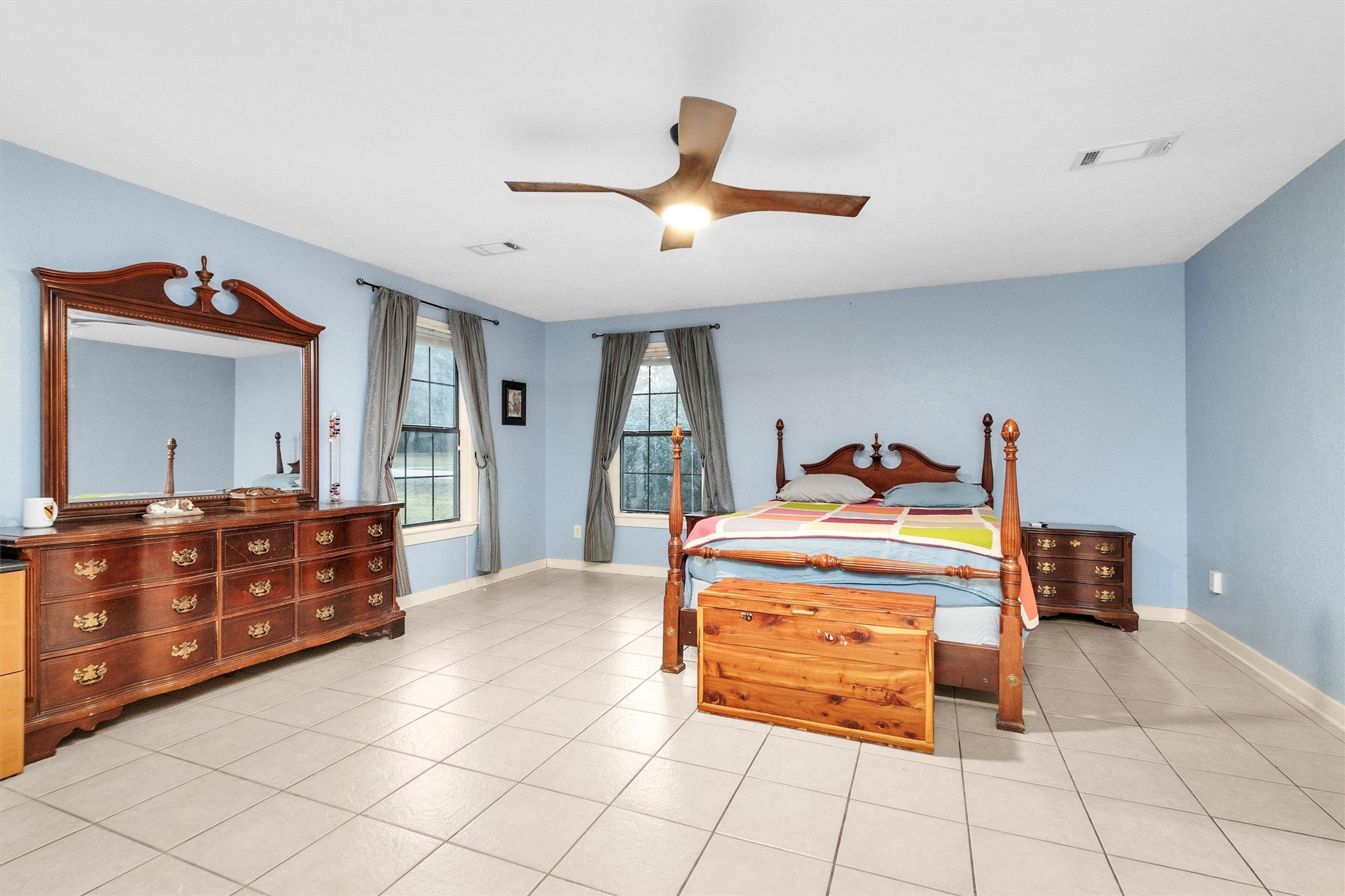 528 Catfish Lane Conroe, TX 77384 - Photo 21 of 49 a bedroom with a bed and a dresser in it