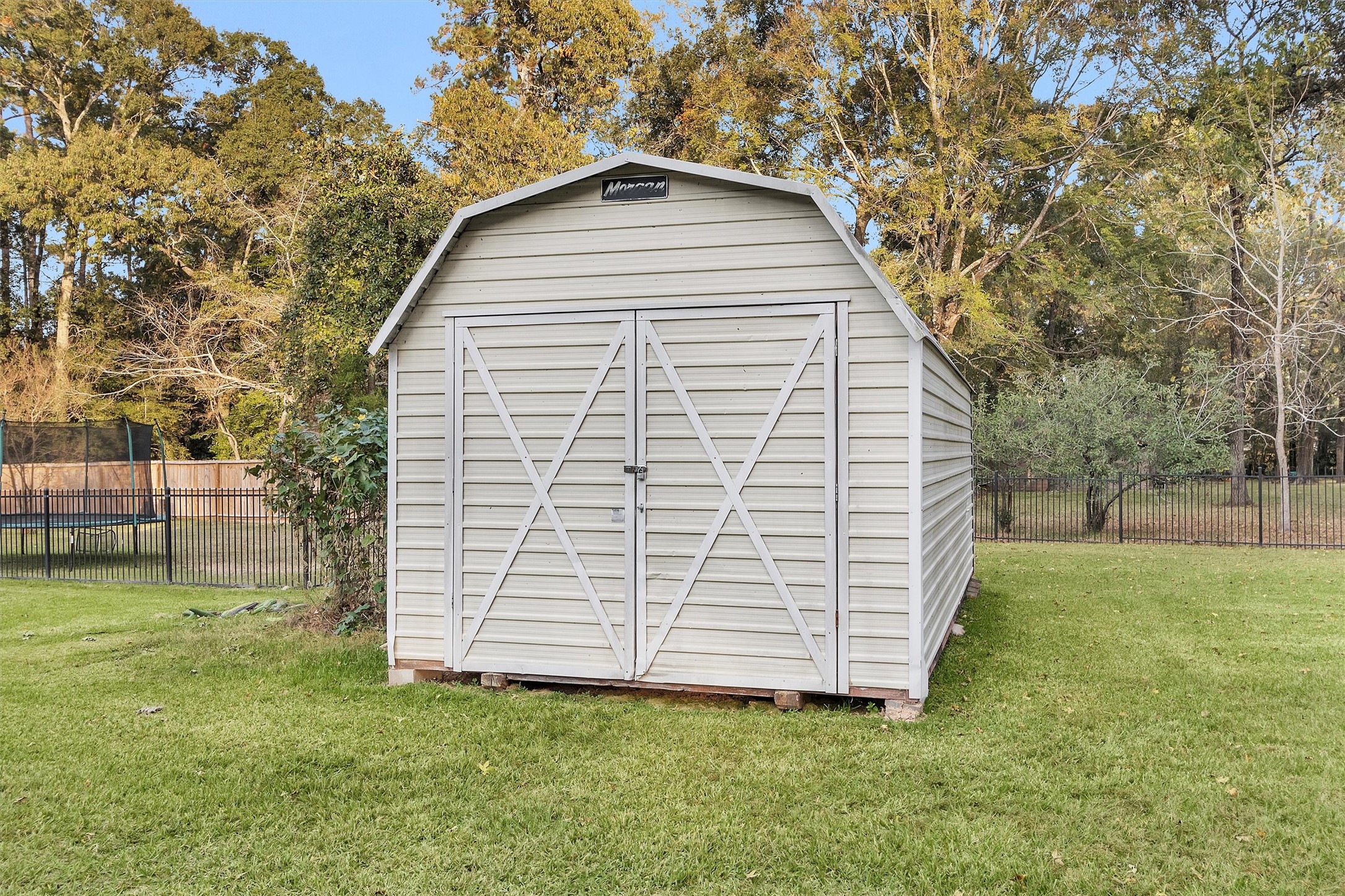 528 Catfish Lane Conroe, TX 77384 - Photo 35 of 49 a view of a backyard with a garden