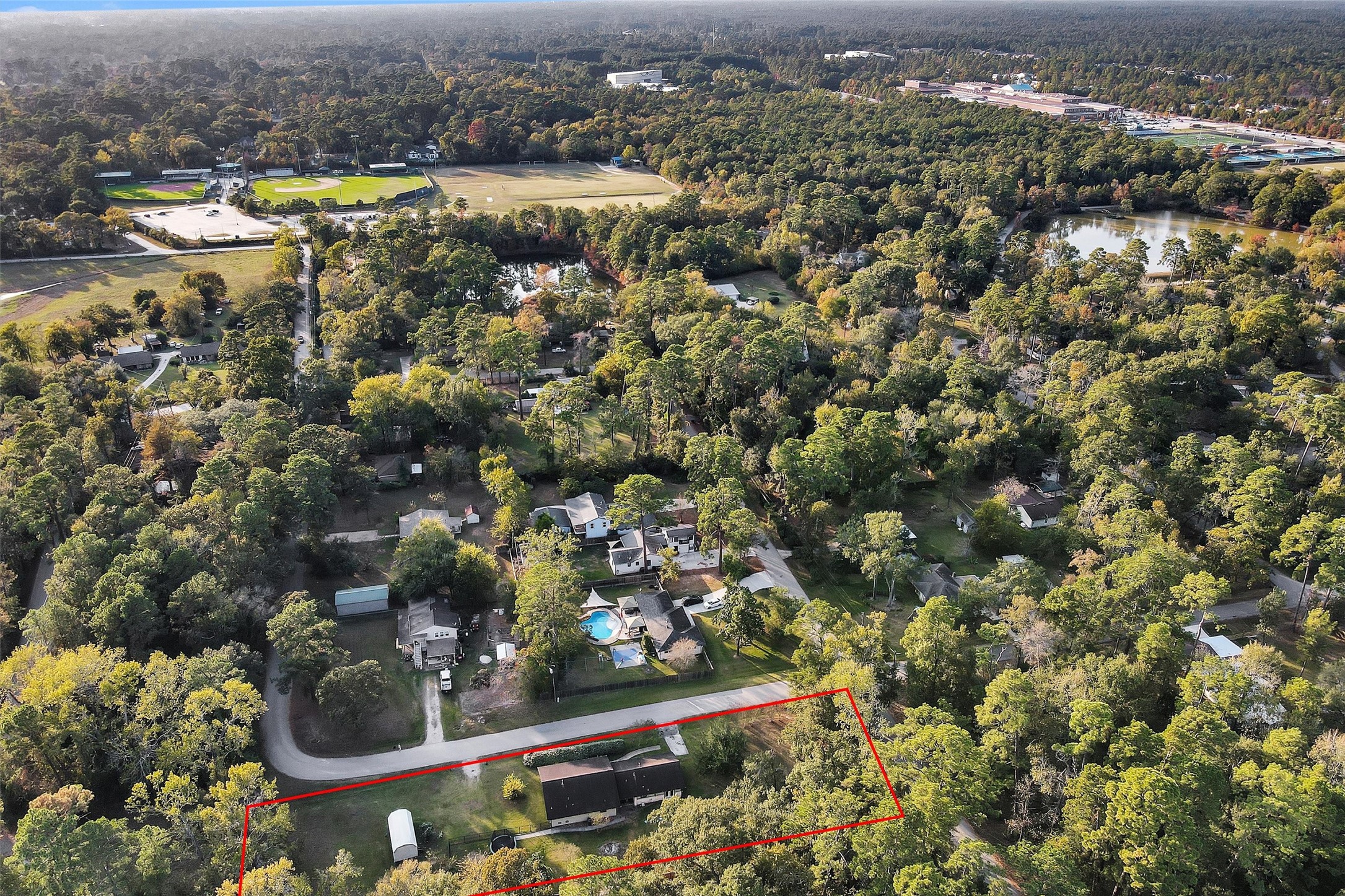 528 Catfish Lane Conroe, TX 77384 - Photo 47 of 49 an aerial view of residential houses with outdoor space and swimming pool
