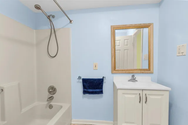 a bedroom with pink walls and pink walls