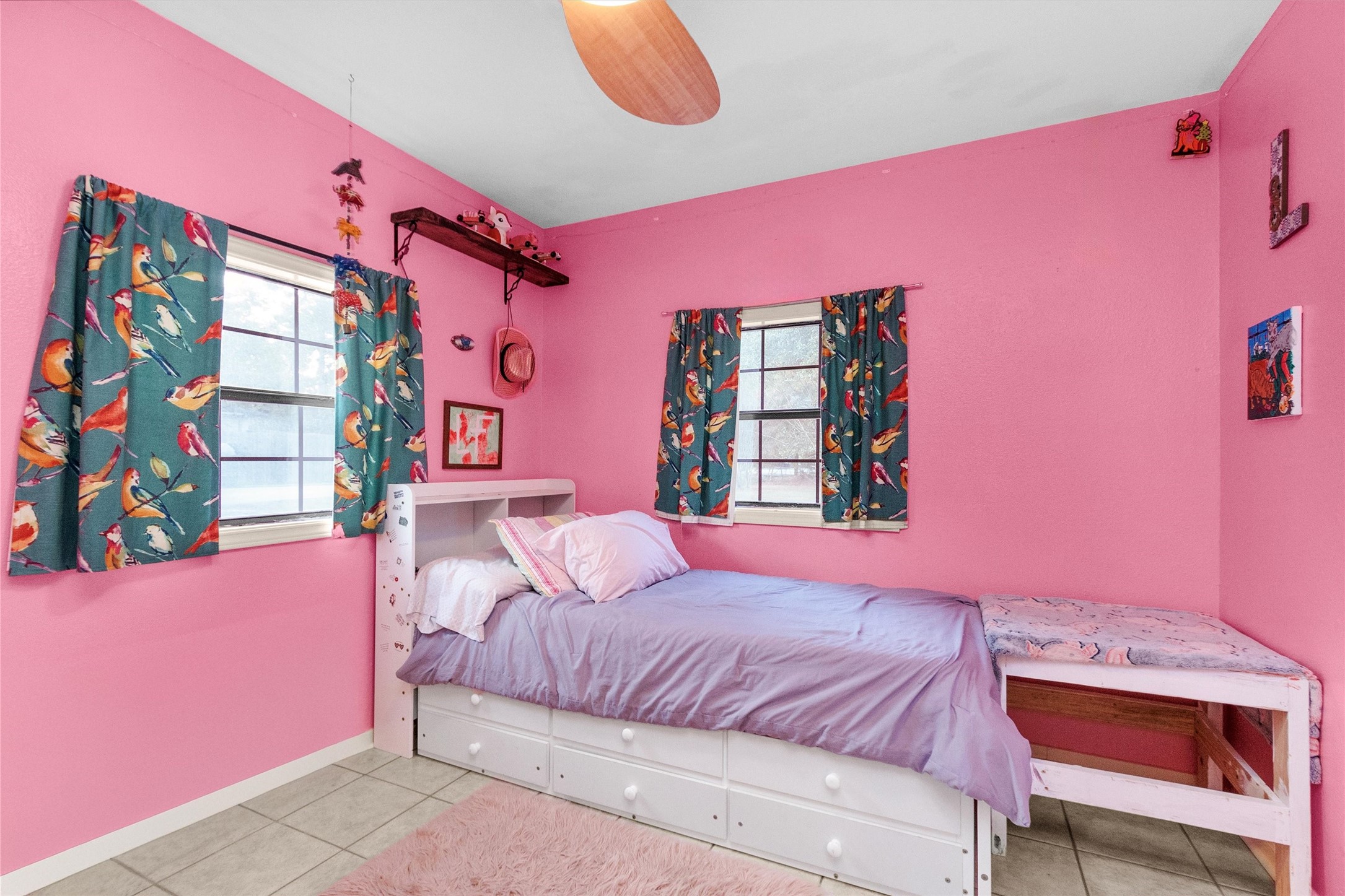 528 Catfish Lane Conroe, TX 77384 - Photo 9 of 49 a bedroom with pink walls and pink walls