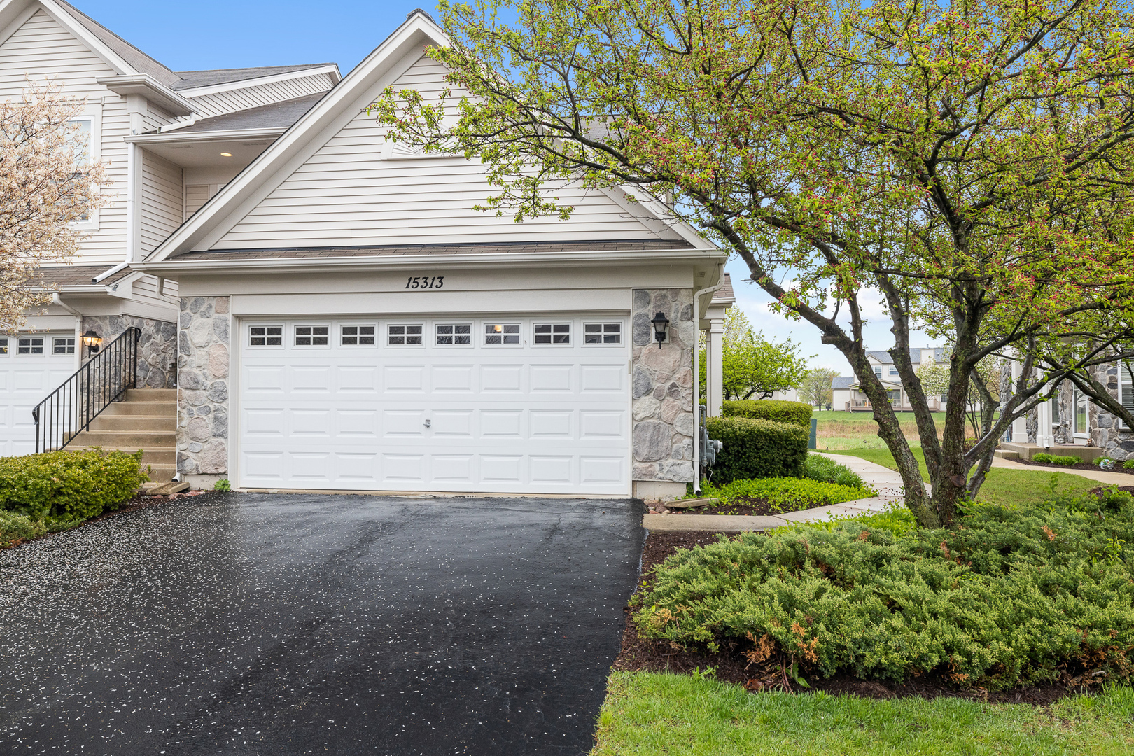 15313 Pinewood Road, Unit 15313 Lockport, IL 60441 - Photo 1 of 15 a house with trees in front of it