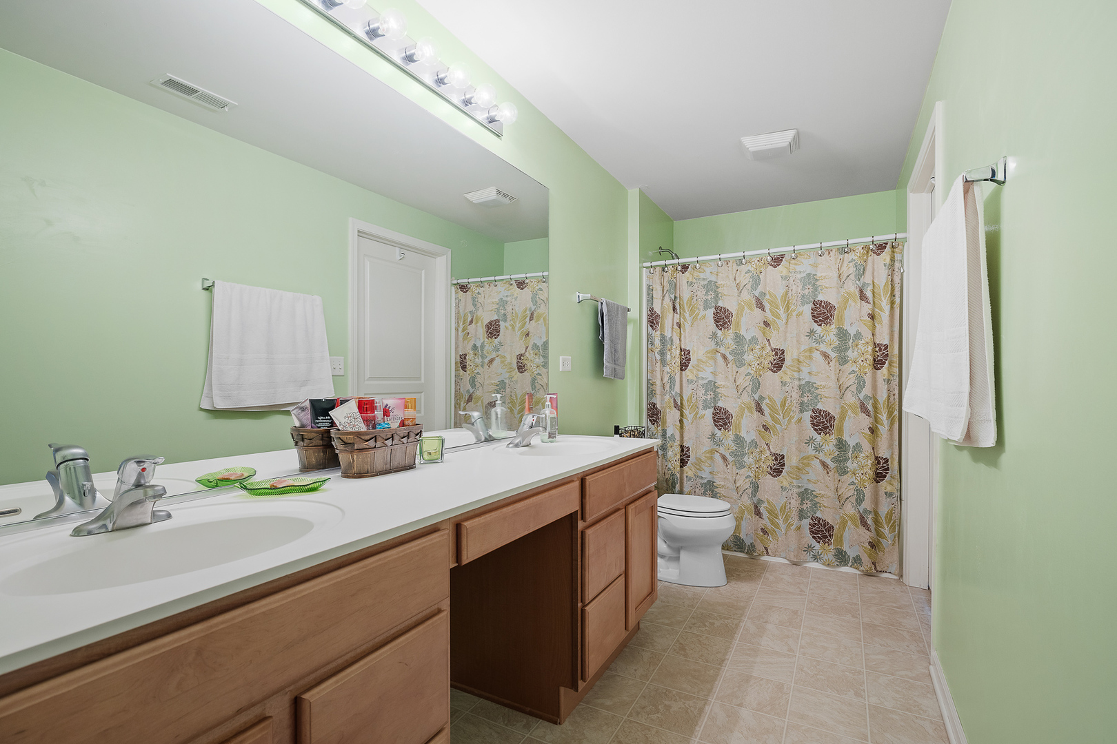 15313 Pinewood Road, Unit 15313 Lockport, IL 60441 - Photo 9 of 15 a bathroom with a double vanity sink toilet and shower