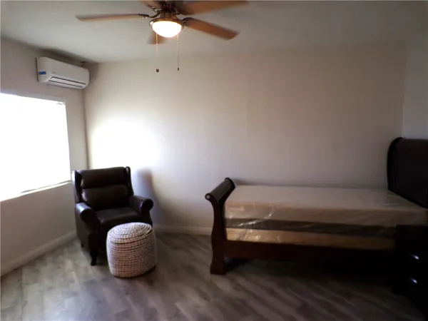 a living room with furniture and a chair