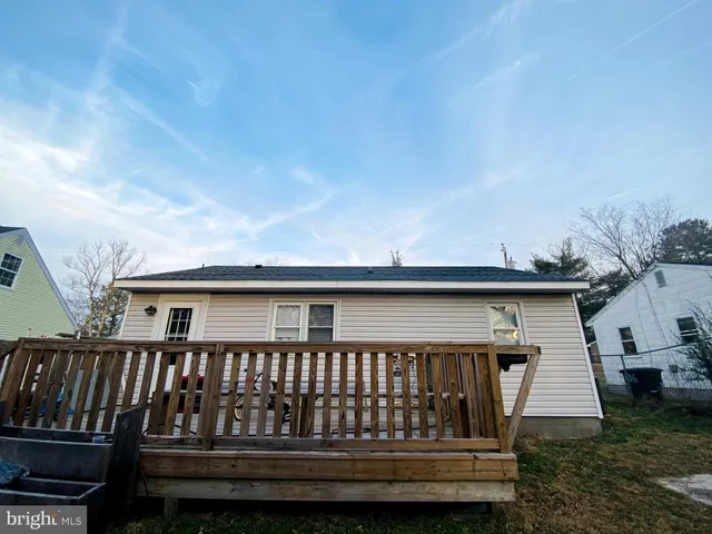 a view of a backyard with sitting area