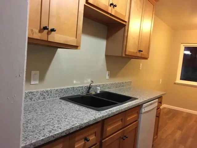 a kitchen with a sink and cabinets