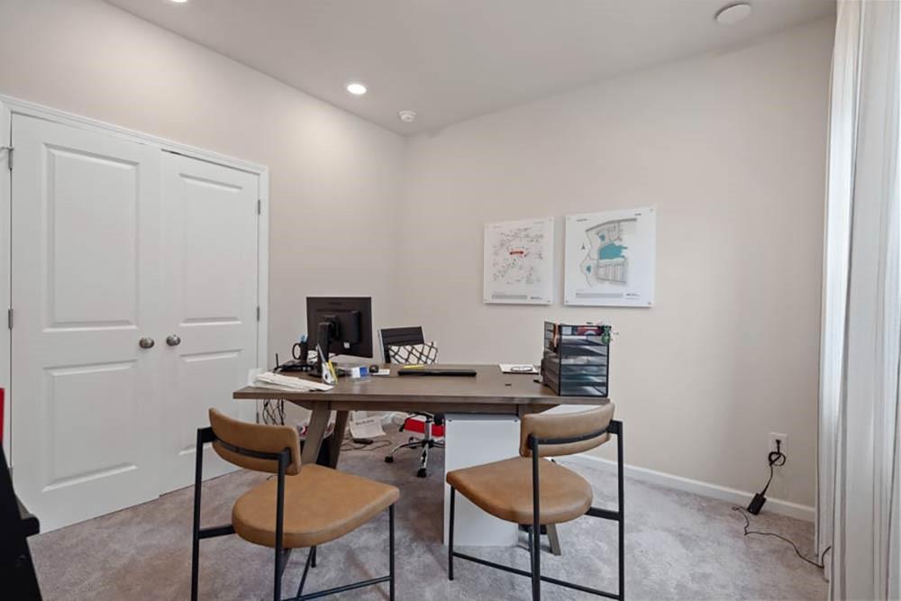 106 Epperly Way Tucker, GA 30084 - Photo 7 of 44 a workspace with furniture and wooden floor
