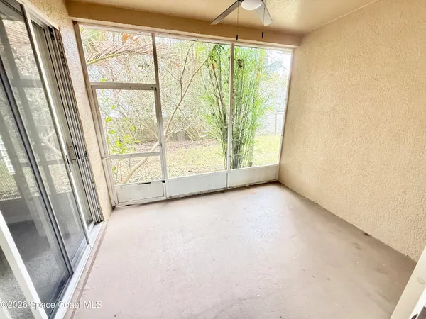 a view of an empty room with a large window