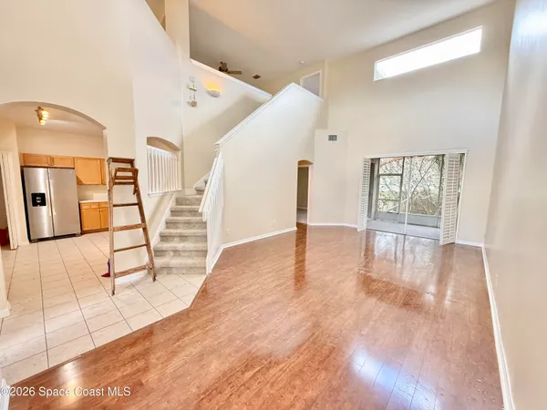 a view of an entryway with wooden floor