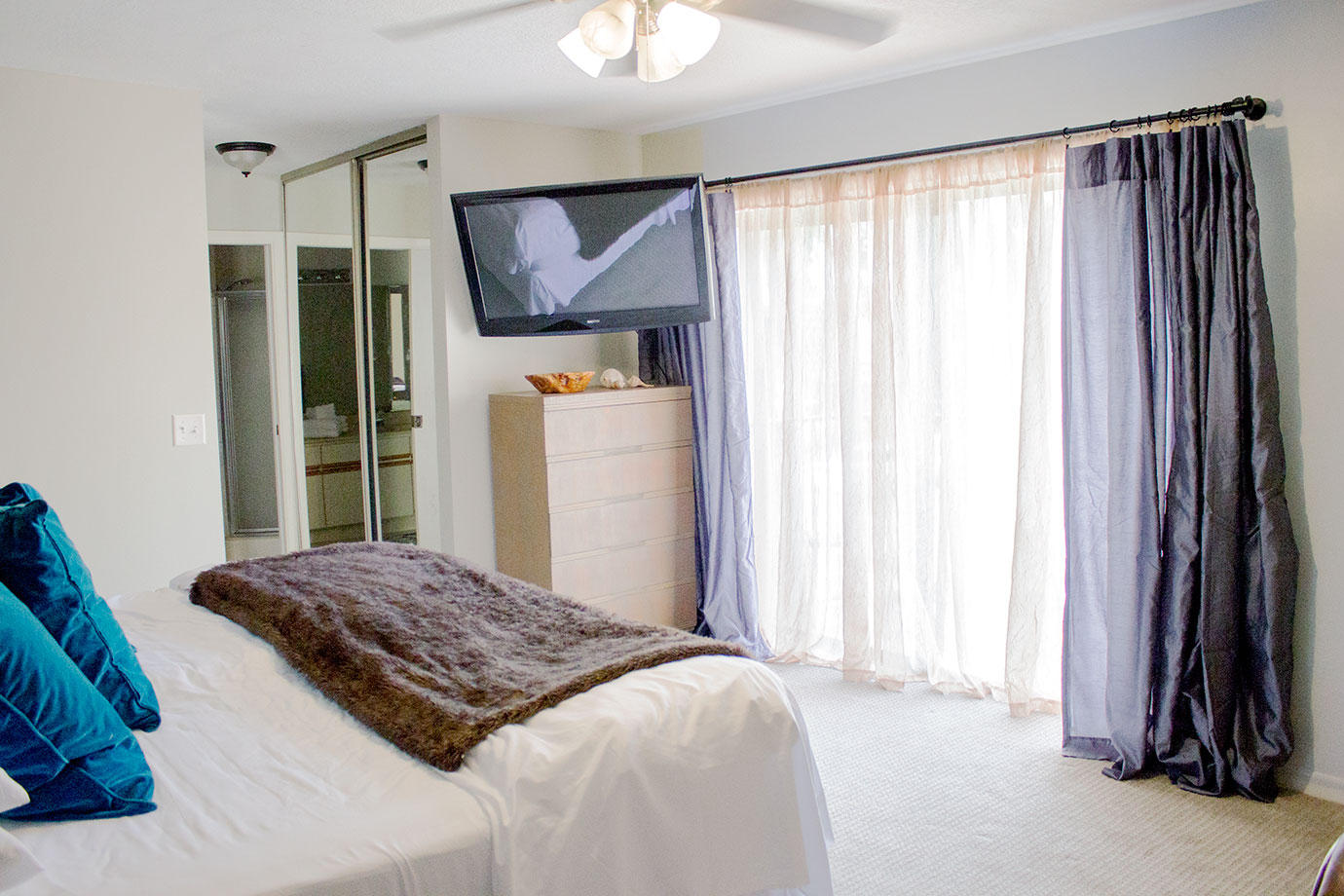 8265 Boca Rio Drive Boca Raton, FL 33433 - Photo 12 of 18 a bedroom with a bed and a mirror