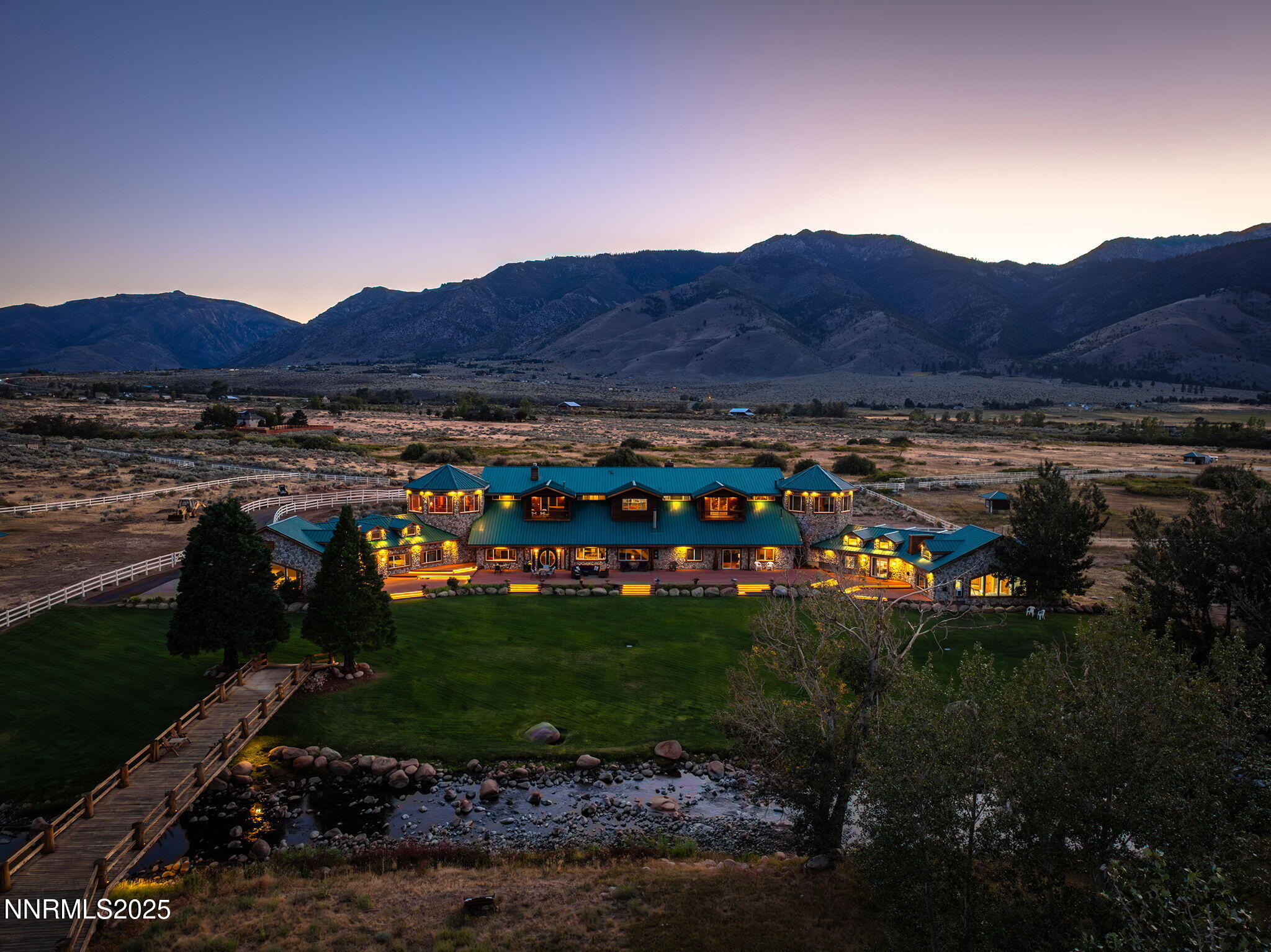827 River Ranch Road Markleeville, CA 96120 - Photo 1 of 46 a view of a lush green field with mountains in the background
