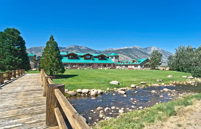a view of a garden with a building in the background