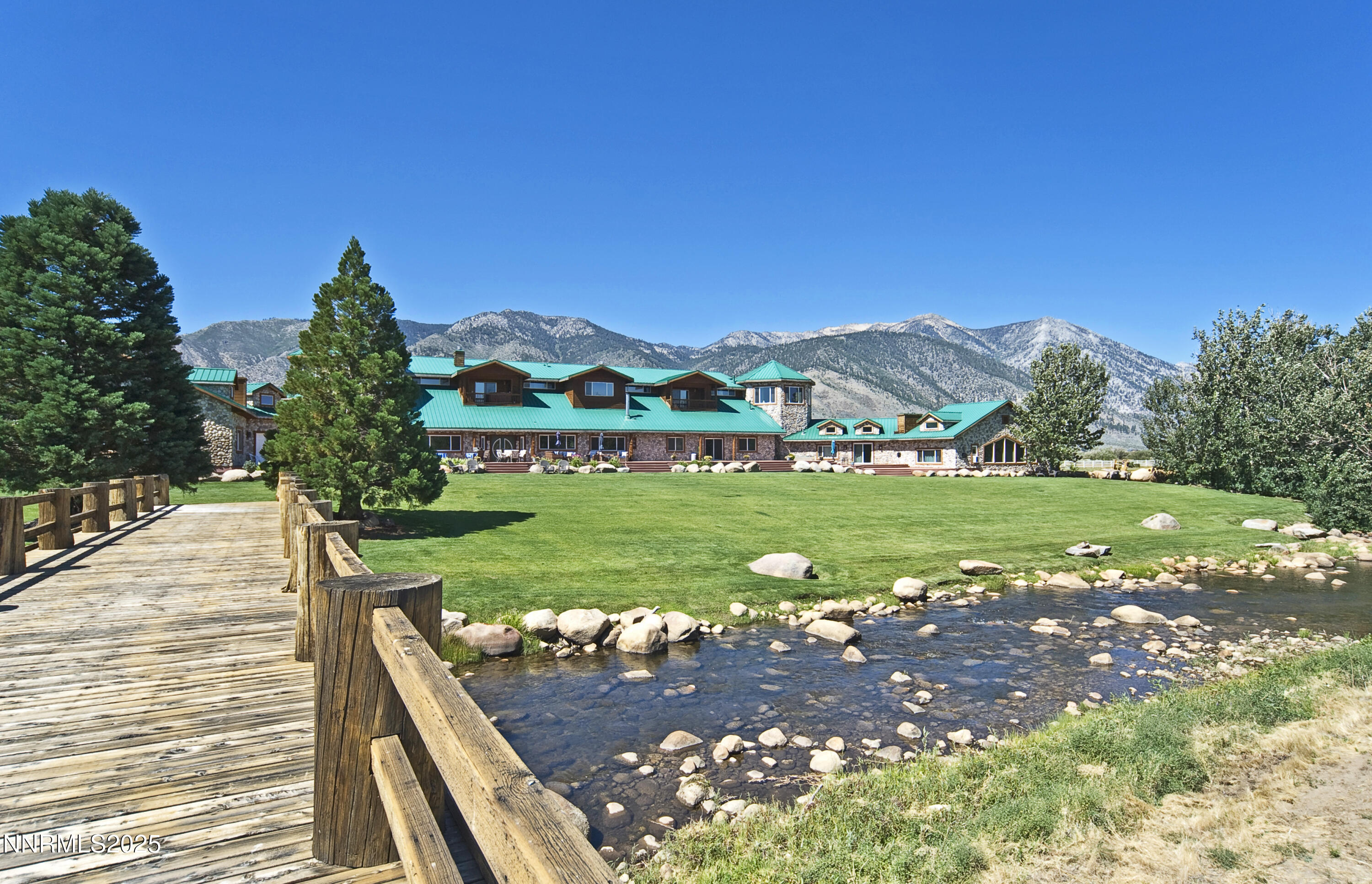 827 River Ranch Road Markleeville, CA 96120 - Photo 13 of 46 a view of a garden with a building in the background