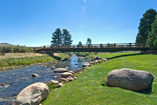 a view of a golf course with chairs