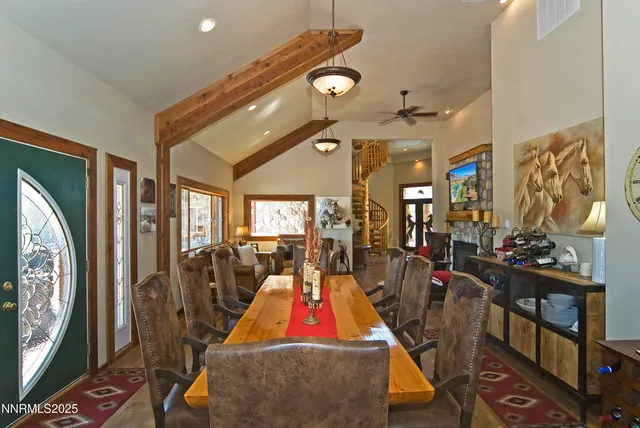 a very nice looking room with many windows and furniture