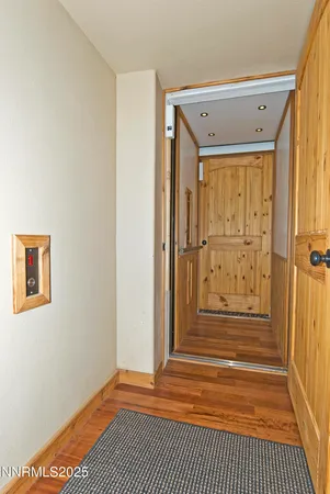 a view of a door with wooden floor