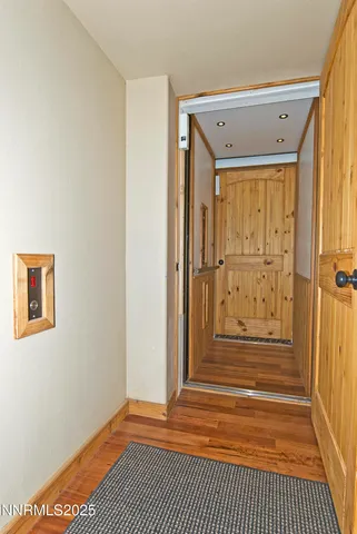 a view of a door with wooden floor