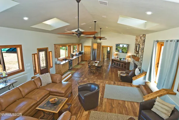 a view of a livingroom with furniture and a flat screen tv