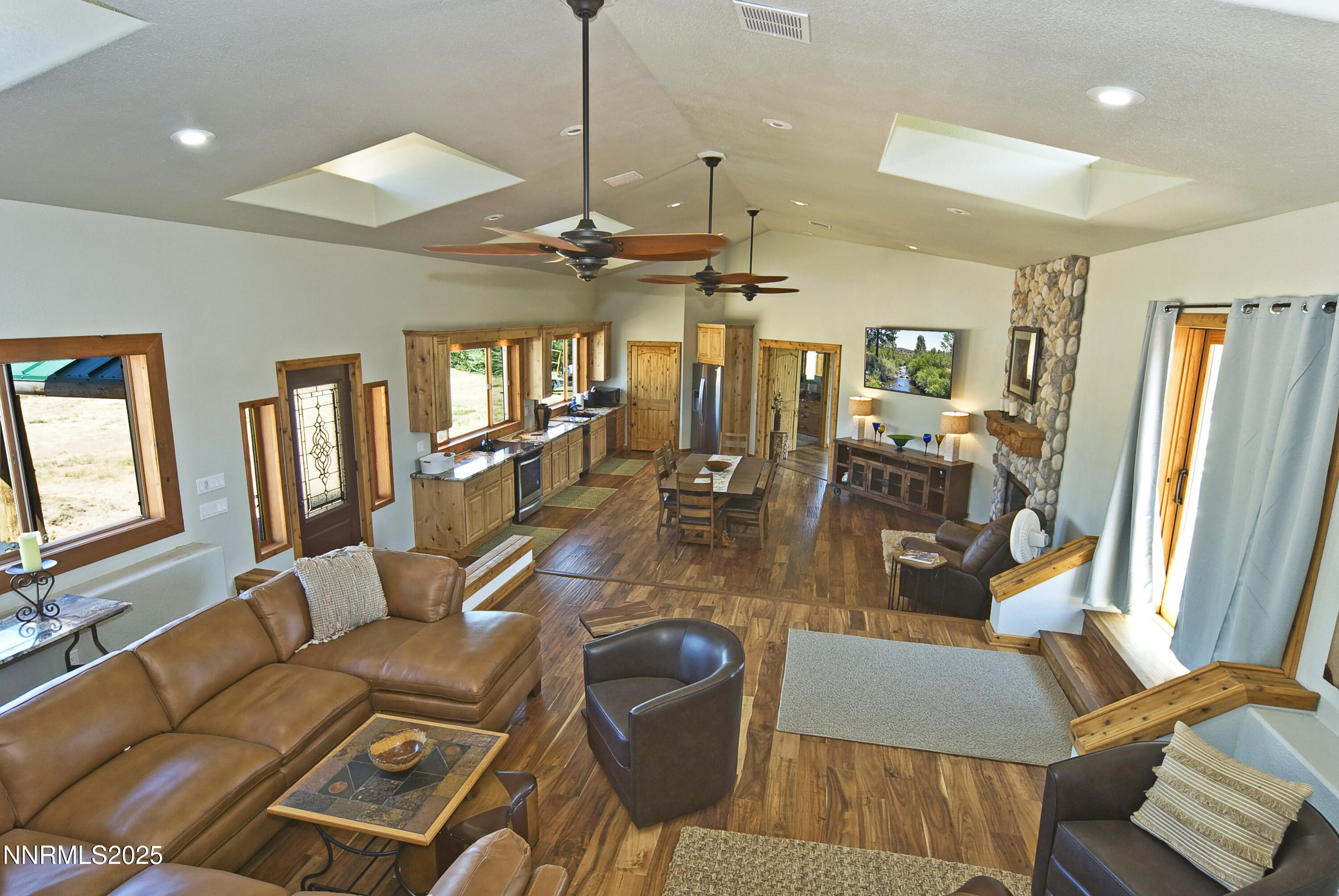 827 River Ranch Road Markleeville, CA 96120 - Photo 25 of 46 a view of a livingroom with furniture and a flat screen tv