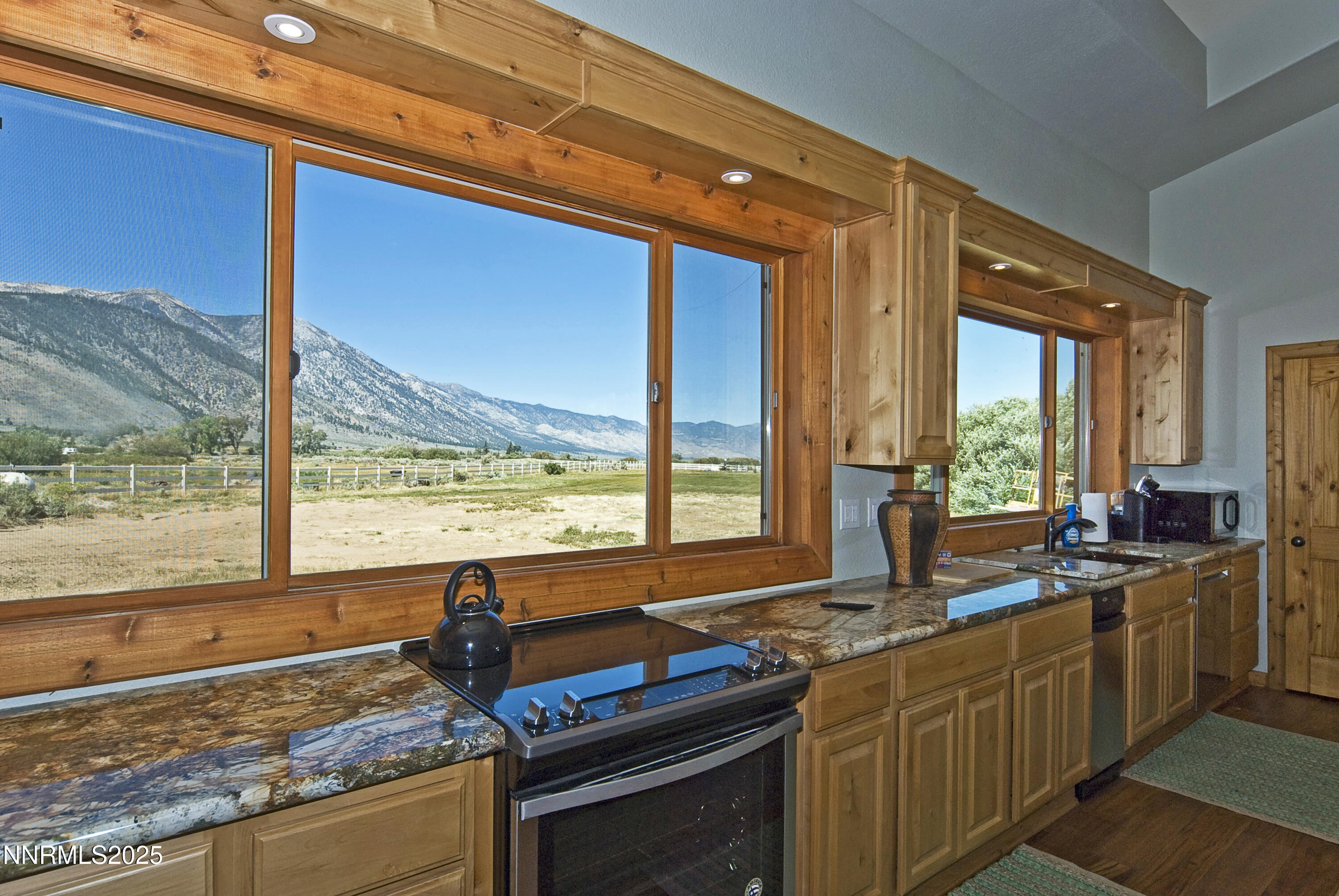 827 River Ranch Road Markleeville, CA 96120 - Photo 26 of 46 a kitchen with stainless steel appliances granite countertop sink stove and large window